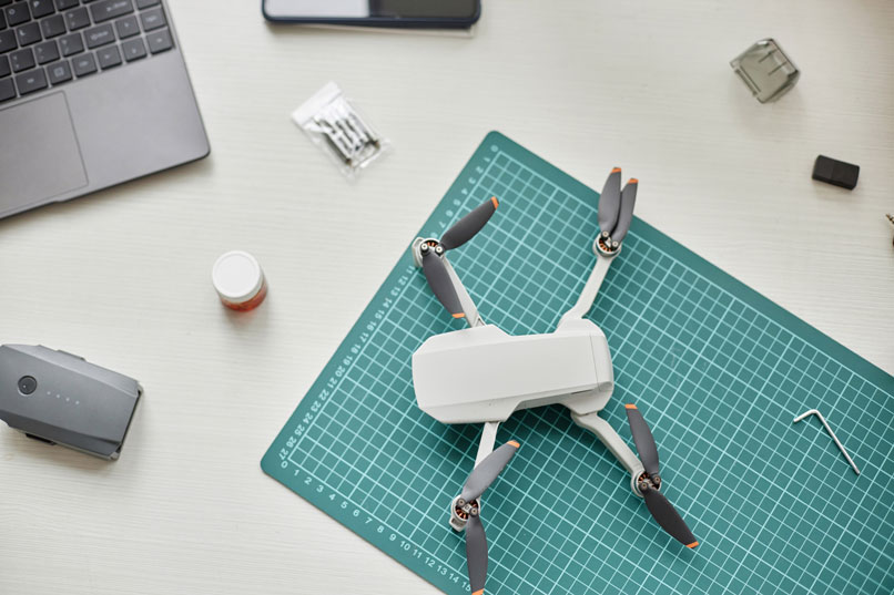 drone customization - drone on table with design grid - newtodrones