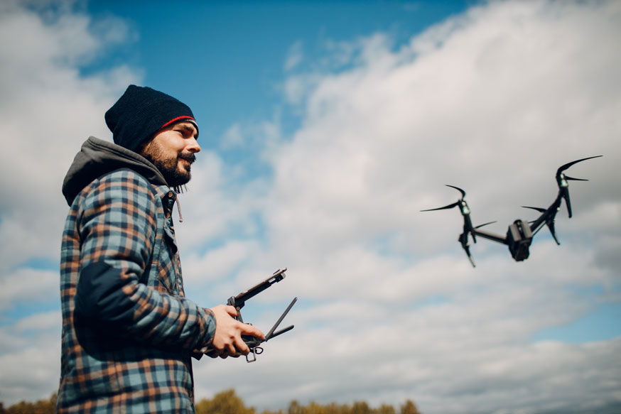 drone etiquette - man flying drone - newtodrones