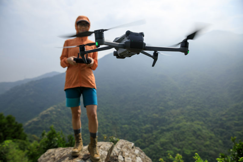 drone photography for conservation - conservationist launching drone in remote area - new to drones