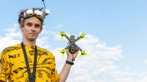 drone racing - man holding high performance racing drone - newtodrones