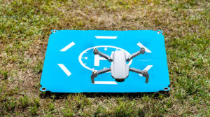 drone registration requirements - drone on a blue landing pad - new to drones